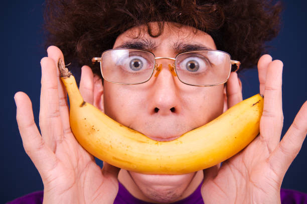 istock Funny emotional guy eats fruits and vegetables. 1609011566