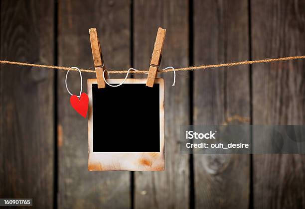 Blank Vintage Photo And Red Paper Heart Hanging On Clothesline Stock Photo - Download Image Now