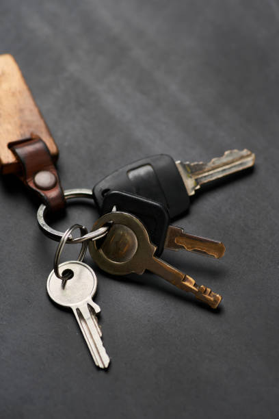 istock The bunch of keys on the black floor 1609029439