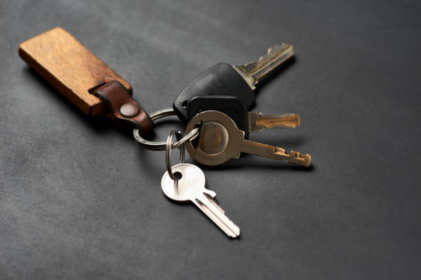 istock The bunch of keys on the black floor 1609031652