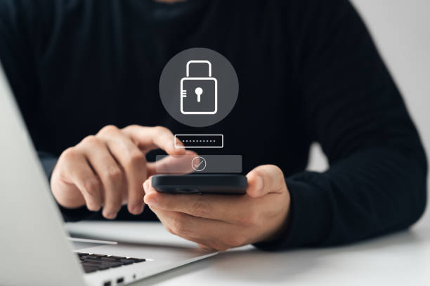 istock Cybersecurity privacy of data protection, businessman using smartphone and laptop Secure encryption technology, security Internet access, security encryption of user private data. 1609037118