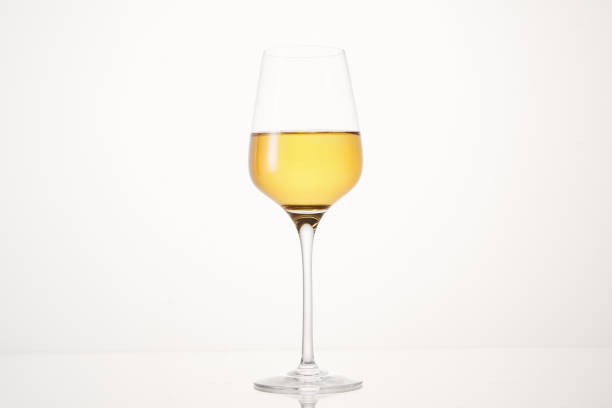 istock Half wineglass filled with exquisite white wine. 1609037684