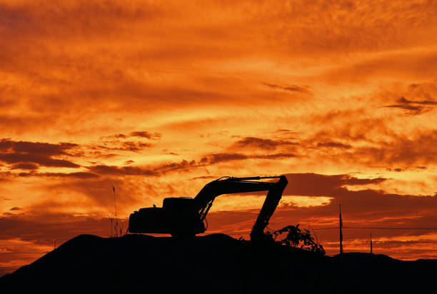 silhouette of backhoe stock photo