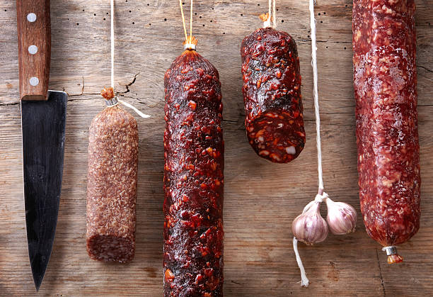 istock various hanging salami sausages 160905814