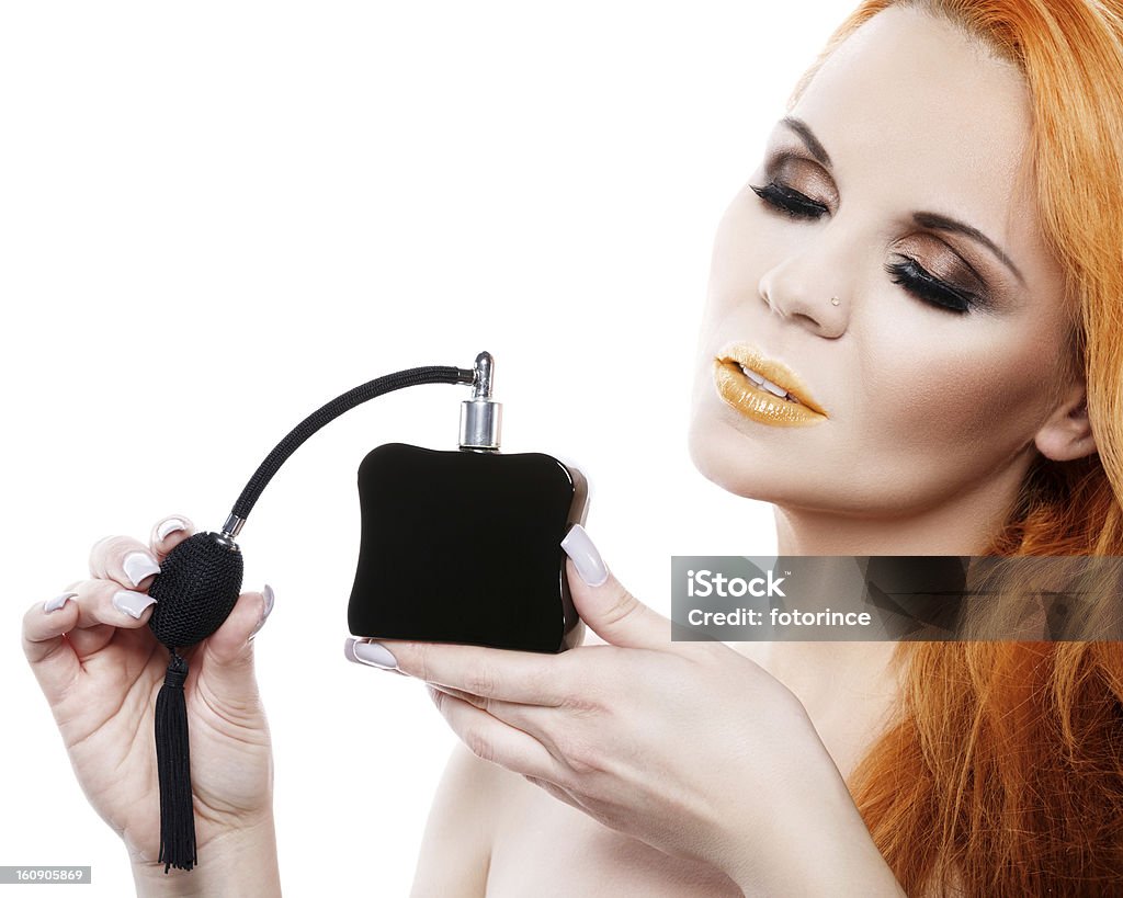 Beautiful woman with perfume Beautiful woman with perfume on a white background Adult Stock Photo