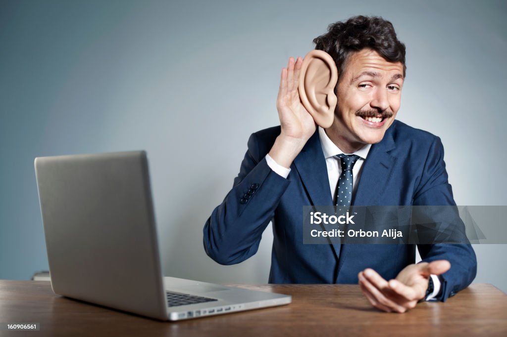 Businessman with big ear Businessman with a big ear, sutdio photo Ear Stock Photo