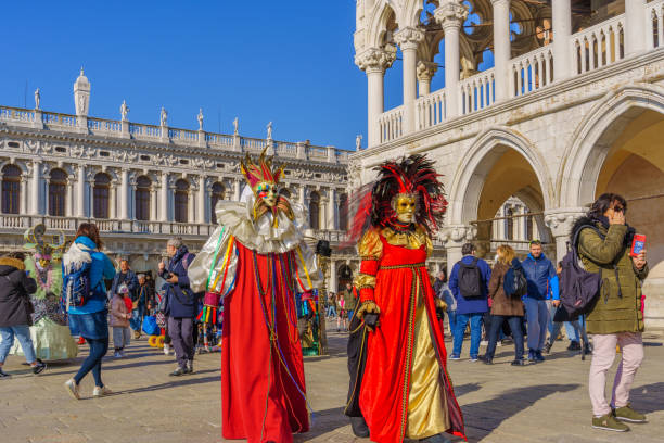 Group dressed in traditional costumes, Venice Mask Carnival stock photo