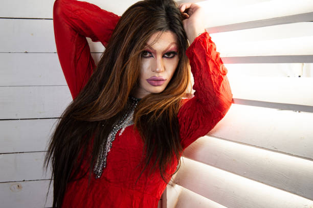 istock Drag queen in a provocative outfit poses in the studio. 1609086486