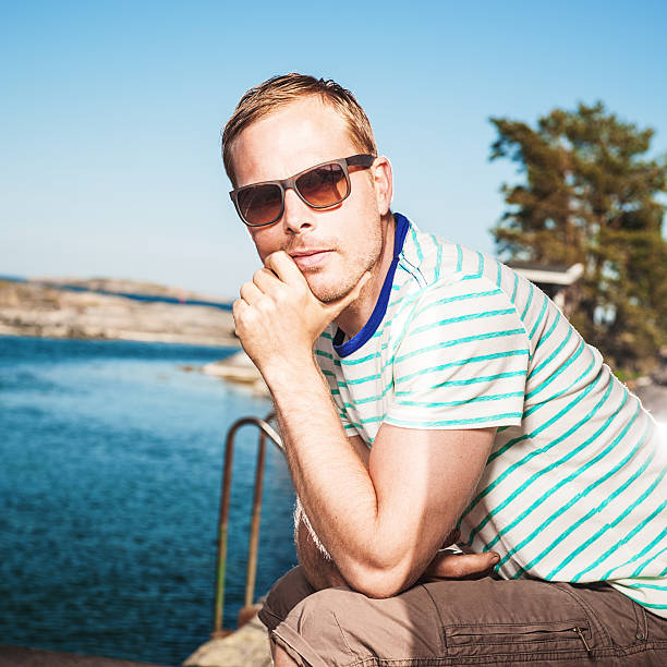 Man by the ocean coast