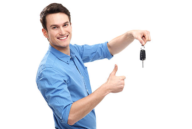 Man with Car Keys and Thumbs Up stock photo