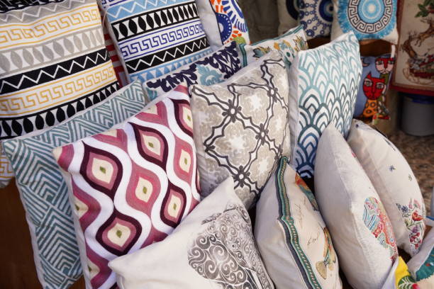 istock Decorative pillows with a geometric pattern of a rustic design. Embroidered cushion with national Greek ornament at a gift shop 1609151157