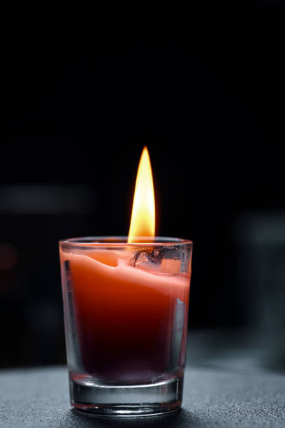 istock The candle flame in the darkness 1609172166