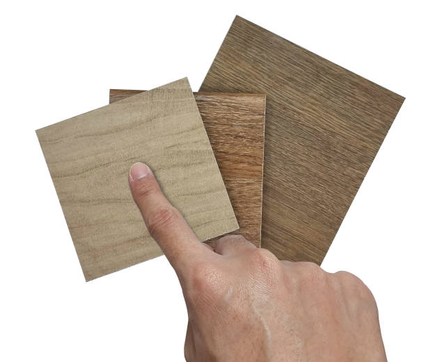 istock designer's hand picks swatch of ceramic flooring tiles samples isolated on background with clipping path. palette texture of natural ceramic floor decorating tile samples as wood. 1609174775