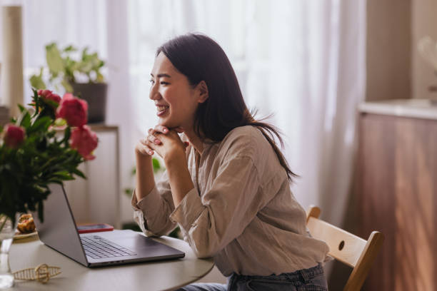 istock A Happy Asian Businesswoman Working From Home On Her Computer 1609190538