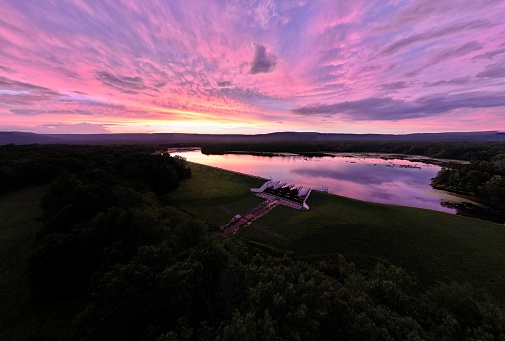 An aerial view of Minsi Lake in Pennsylvania, USA, with a stunning purple sky in the background