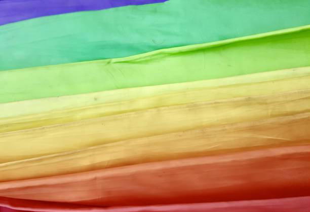 istock a photography of a rainbow colored fabric is shown in this image, sleeping bag with a rainbow of colored sheets on it. 1609201225