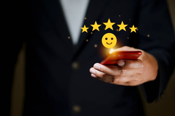 istock businessman using smartphone and pushing smile button for the best evaluation , customer satisfaction concept. 1609201319