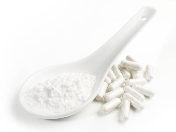 Manganese Powder with Capsules isolated  on white Background