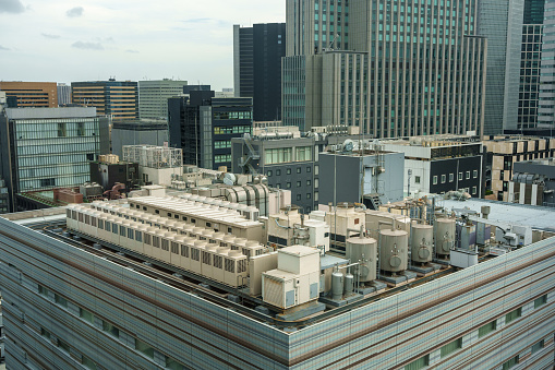 Air conditioning equipment installed on the roof of an urban building