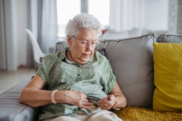 istock Diabetic senior patient injecting insulin in her belly. 1609309704