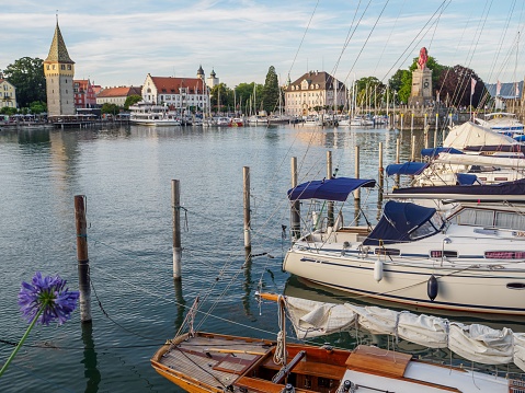 lindau, Germany – May 18, 2022: A line of sailboats docked at a marina on Lake Constance in Lindau, Germany