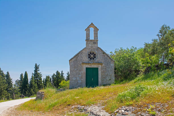 Church in Nerezisca on Brac Island, Croatia The Church of Saint Jacob and Saint Philip outside Nerezisca town on Brac Island, Croatia. Called Crkva Sv Jakov i Filip in Croatian old catholic church on island brac croatia stock pictures, royalty-free photos & images