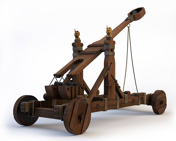 Norman Catapult An ancient Norman Catapult isolated on a white background. Clipping path is included. trebuchet weapon slingshot medieval stock pictures, royalty-free photos & images
