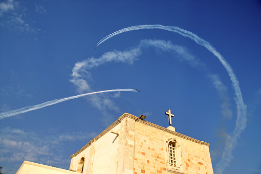 view of the sky with the air trails of the Frecce Tricolori