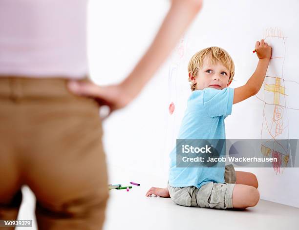It Wasnt Me Stock Photo - Download Image Now - Child, Wall - Building Feature, Mischief