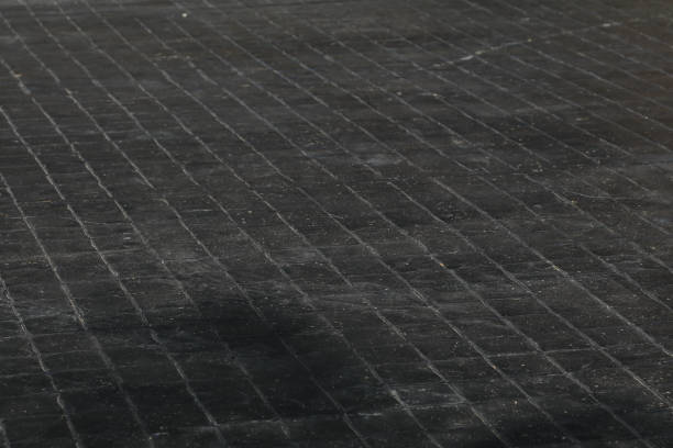 istock Black Street Floor - Black walkway is a solid concrete pavement for commuting and walking office buildings for traffic and transportation. 1609395006