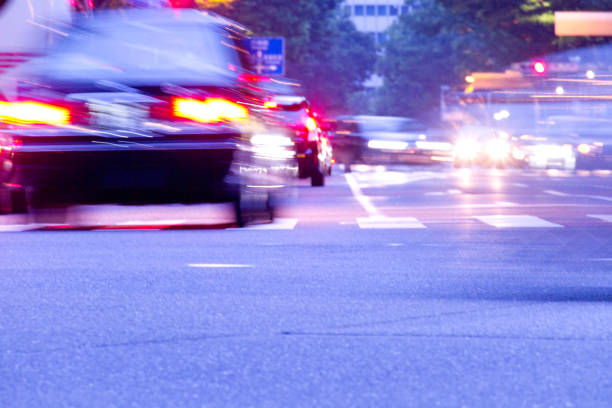 istock Crosswalk and blurred car tail lamps 1609401505