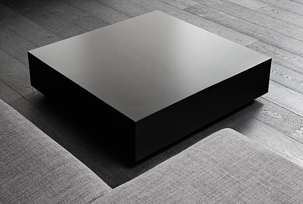 Black square coffee-table, modern interior detail stock photo