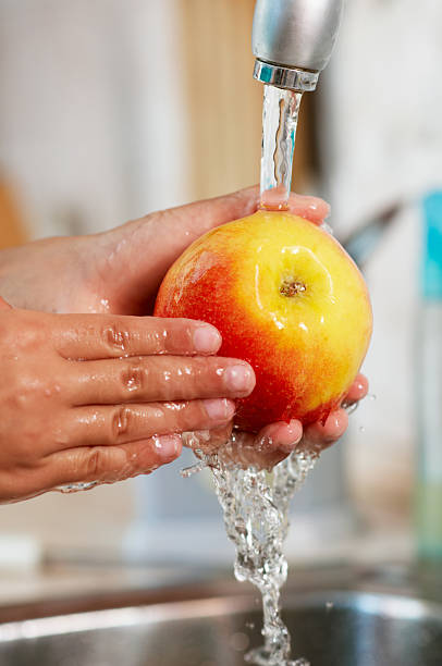 istock The apple is being washed in water 160942125