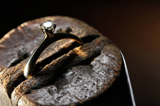 istock gold ring with brilliant cut diamond in goldsmith workshop 1609429075