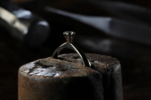 istock gold ring with brilliant cut diamond in goldsmith workshop 1609429229