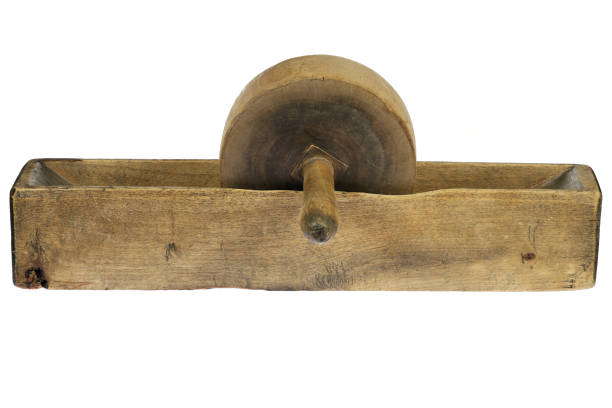 wooden roller mill from the early 19th century isolated on white background