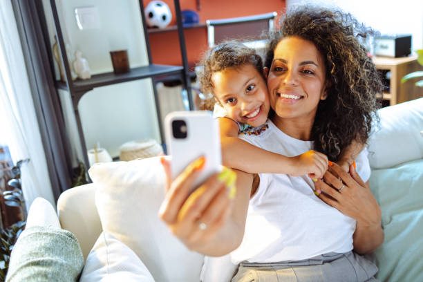 istock Mother and daughter taking a selfie together 1609438551