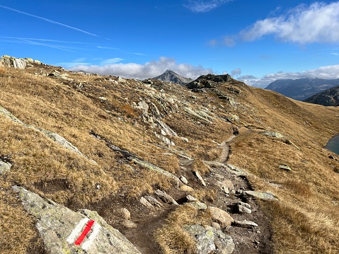 Hiking trails or mountaineering routes in the autumn Swiss Alpine environment and in the St. Gotthard pass (Gotthardpass) mountain area, Airolo - Canton of Ticino (Tessin), Switzerland (Schweiz)