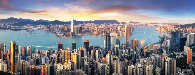 View of rural green fields with fish ponds between Hong Kong and skylines of Shenzhen,China