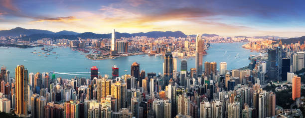 Hong Kong at dramatic sunset, China skyline - aerial view Hong Kong at dramatic sunset, China skyline - aerial view kowloon stock pictures, royalty-free photos & images