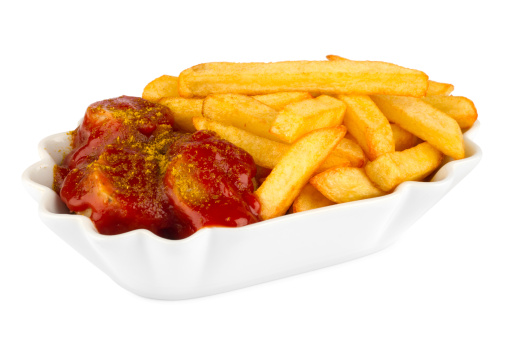 ceramic bowl with curry sausage and french fries