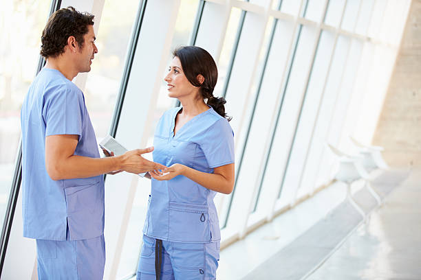 istock Medical staff talking in a hospital corridor 160945491