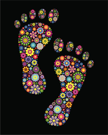 Illustration of colorful footprints on black background