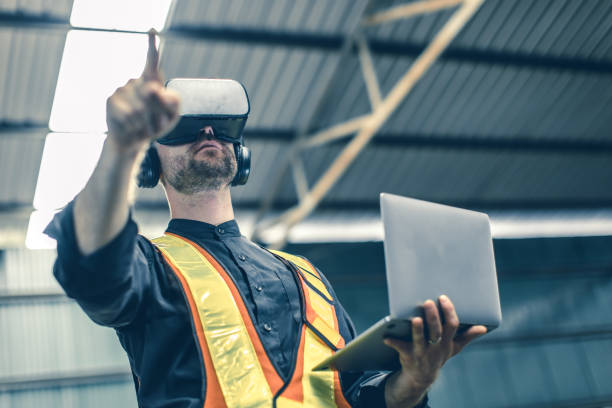 istock Engineer male using VR virtual reality technology in modern warehouse factory new innovation engineering 1609464498