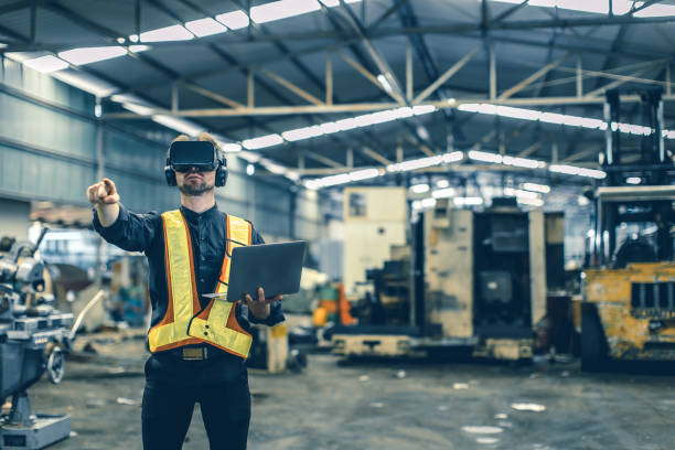 istock Engineer male using VR virtual reality technology in modern warehouse factory new innovation engineering 1609464501