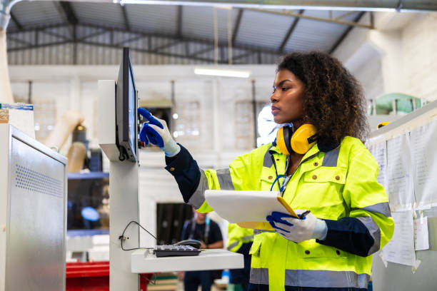 istock staff woman worker work operate cutting machine. Lathe CNC engineer. modern factory working woman. smart women worker industry workplace 1609465430