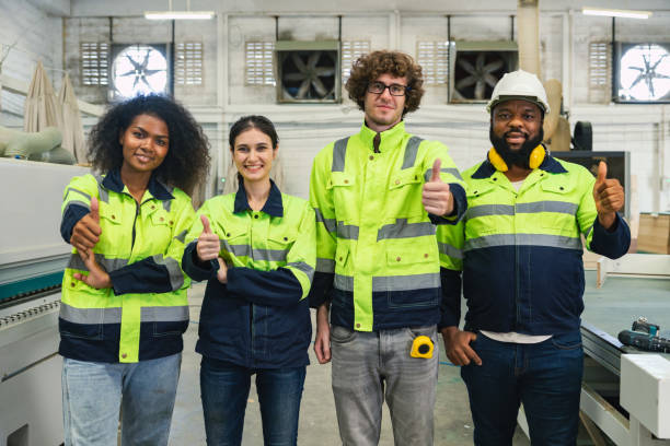 istock Professional team worker celebrating success in machine workshop factory, Cheerful workers group portrait at work, Happiness fair good job, success teamwork 1609465605