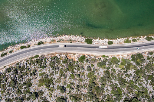 Aerial view of coastal road, aerial view of cliff side road, beautiful road with scenery, Finike, Demre, Antalya Province, Turkiye.