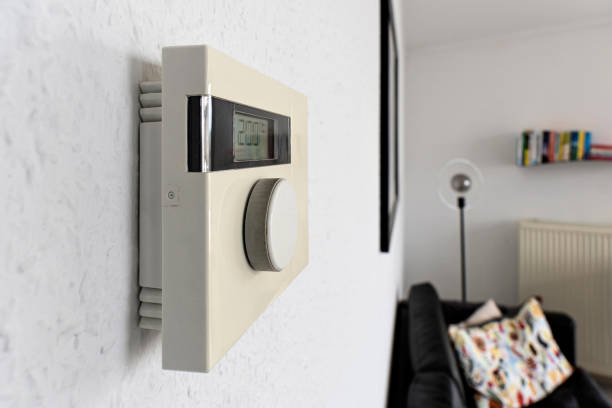 istock wall mounted digital indoor thermostat at 20°C 1609471203