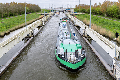 inland cargo vessel in the Prinses Margrietsluis in Lemmer, Netherlands